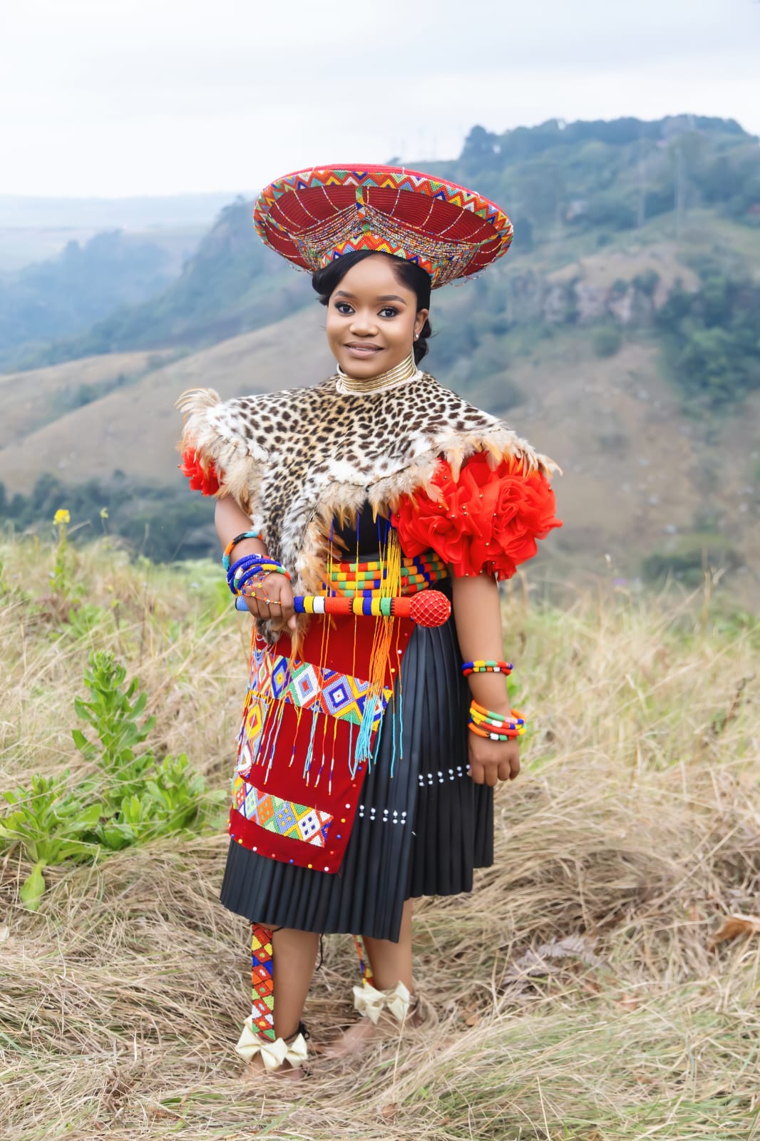 Bride holding a decorative beaded pot